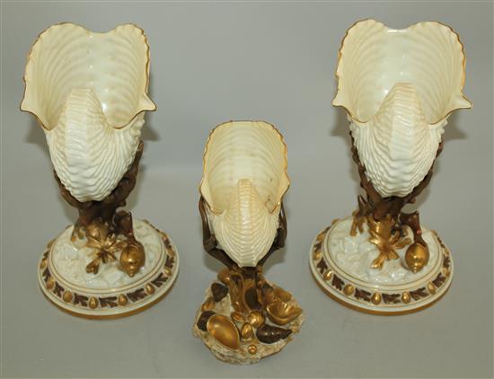 Three Royal Worcester nautilus shell vases, late 19th century, 22cm and 17.5cm